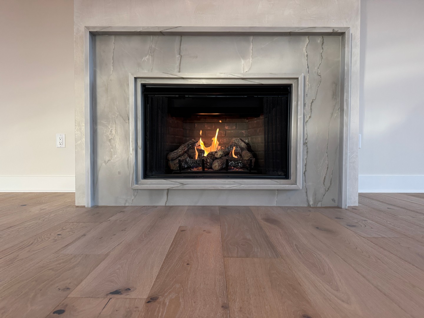 A cozy touch for those rare Florida chill days. This beautifully finished fireplace is ready for whenever the temperatures finally decide to drop in @watersoundorigins.