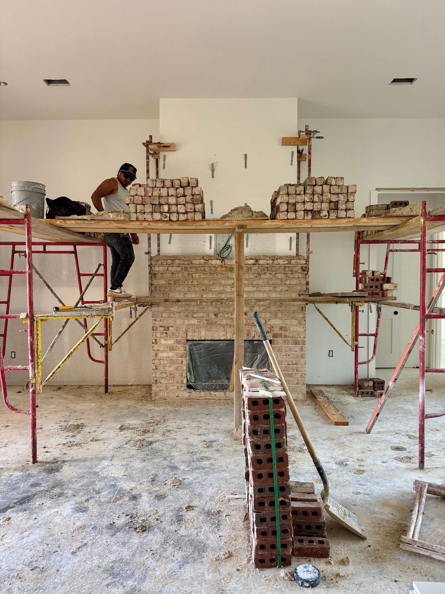 Real craftsmanship is built one brick at a time.  This fireplace is coming to life in @watersoundorigins, with each course carefully laid to create a timeless focal point. Before the finishes and styling go in, this is the stage where skill and precision matter most.  It is easy to admire the final result, but the character of a home is shaped right here in the dust, the detail, and the work behind the scenes.